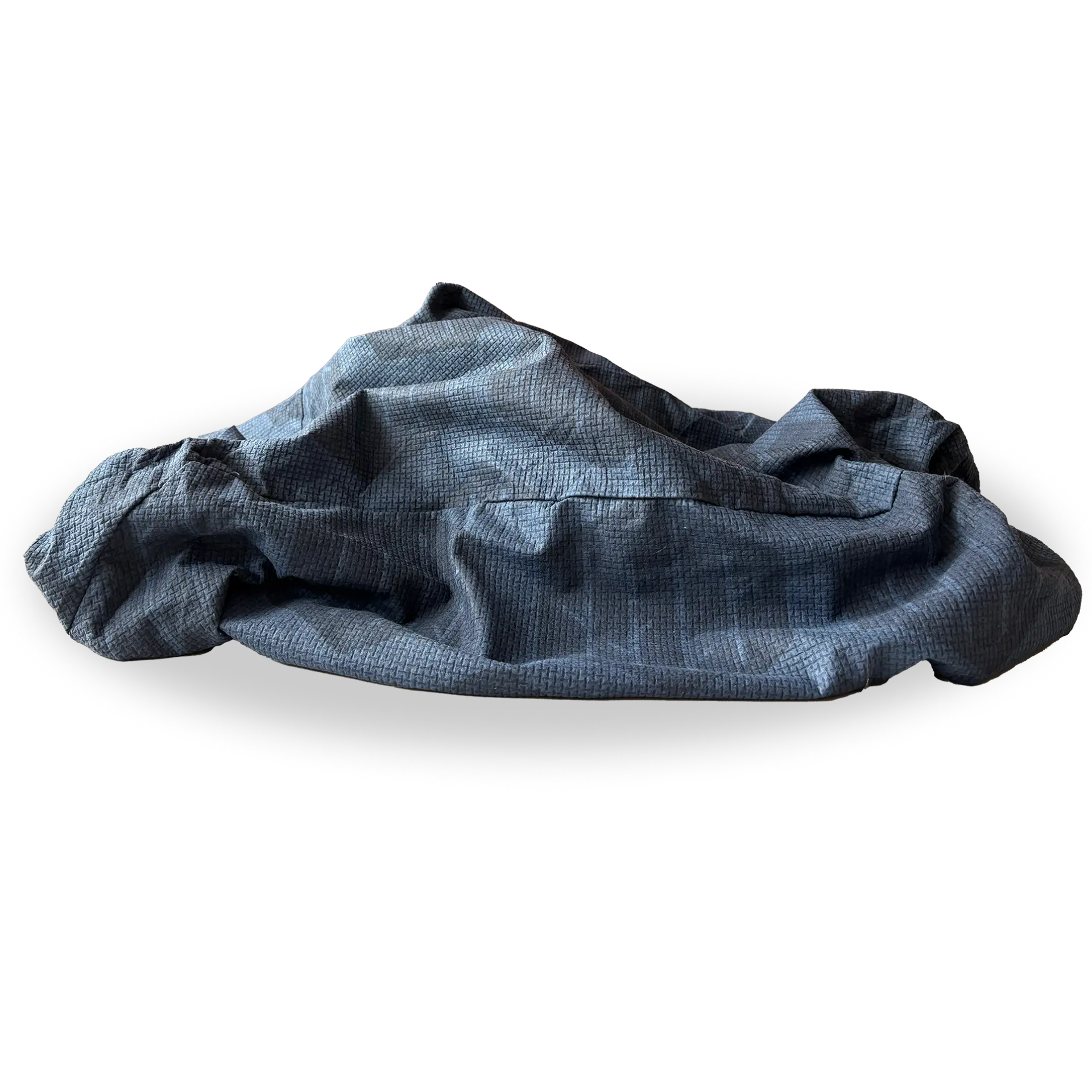 A used Birchwood & Bark deep blue Eco-Cover with a textured surface, loosely crumpled.