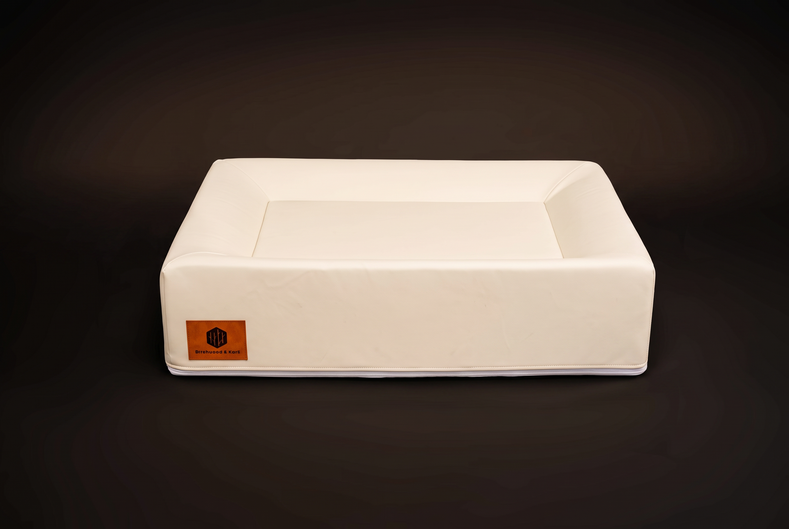 Medium Birchwood & Bark dog bed, side view showing bolster and logo patch